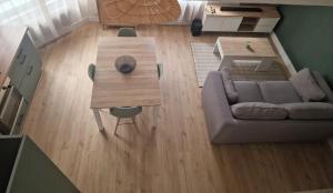 a living room with a couch and a table at Casa Bahia in Berck-sur-Mer