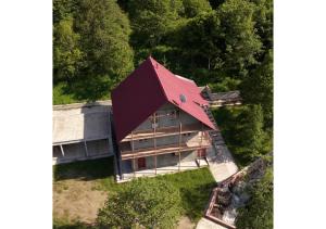 an overhead view of a house with a red roof at Forest Edge Guesthouse in Aghavnadzor
