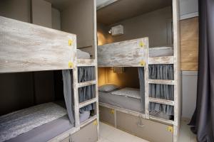 two sets of bunk beds in a room at Onefam Sants in Barcelona