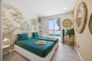 a bedroom with a bed and a mirror at Al Casa Branca in Lourinhã +70 photos