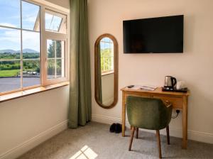 a room with a desk with a mirror at Renard Lodge in Cahersiveen +21 photos