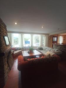 a living room with a couch and a fireplace at Las Asturianas in San Carlos de Bariloche