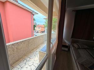 a view of a balcony from a window of a building at Guest House Dayana Double Room 1 in Ravda
