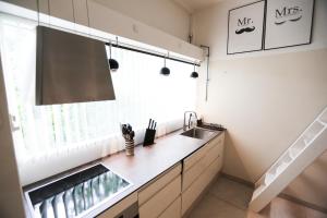 a kitchen with a sink and a window at Exclusive 1 bedroom apartment in Copenhagen