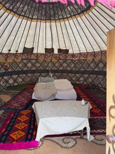 a room with a bed in a yurt at Yurt On The Mountain -With us you will feel the spirit of nomads in Svetlaya Polyana