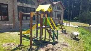a set of playground equipment in a yard at COSY and SPACIOUS APARTMENT C30 in Borovetz in Borovets
