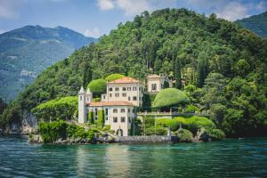 a house on a island in the water at Studio Apartment Lake Views in Acquaseria