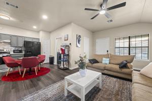 a living room with a couch and a table at Urban Loft in Killeen