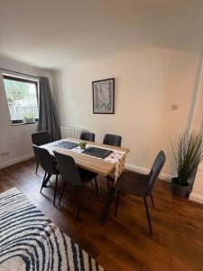 a dining room with a table and chairs at Stay at 48 in Oulton