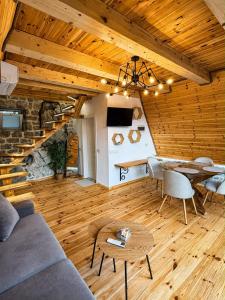 a living room with a couch and a table at Rozafa Sunset in Shkodër