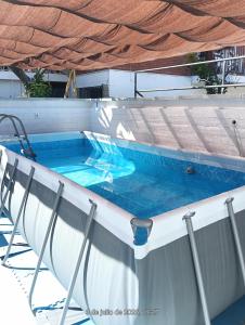 a swimming pool on the deck of a boat at Habitación privada con zonas compartidas in Castellbisbal