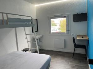 a bedroom with a bed and a desk and a bunk bed at Unisotel Colmar Parc Des Exposition EX F1 in Colmar