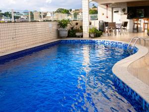 a swimming pool on the roof of a building at Ville de Montagne Hotel in Brumadinho +23 photos
