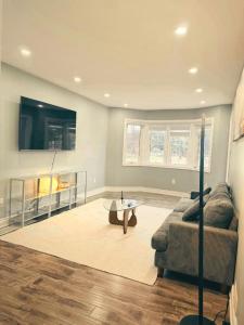 a living room with a couch and a table at Hamilton Central 3BR Family House in Hamilton