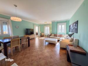 a living room with a couch and a table at Beachfront Apartment - Sea View - COU02 in Ayamonte