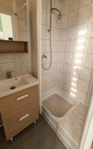 a bathroom with a shower and a tub and a sink at Casa Verde in Berck-sur-Mer