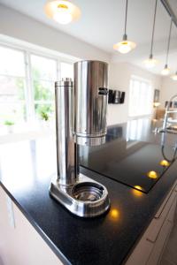 a kitchen counter with a appliance on top of it at Luxurious, spacious apartment - Nordic Style in Copenhagen