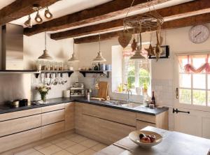 a kitchen with a sink and a counter top at Villa Piscine et Jaccuzzi - Vue Panoramique in Juillac