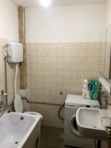 a bathroom with a toilet and a sink at Smještaj Klekovača in Drvar