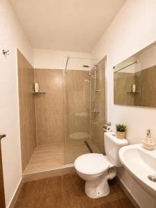 a bathroom with a shower and a toilet and a sink at Villa Smokinya in Sozopol +11 photos