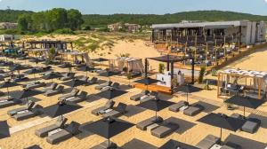 an overhead view of a beach with chairs and umbrellas at Villa Smokinya in Sozopol