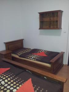 a bedroom with a bed with a wooden frame at ČS Robin Oil Kašperské Hory in Kašperské Hory