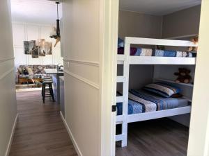 a room with two bunk beds and a kitchen at Hidden Getaway in Pembroke