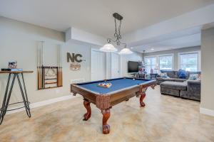 a living room with a pool table in it at 4096 - Cake by the Ocean in Duck
