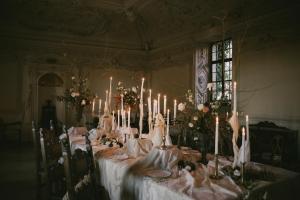 a table with candles on it in a room at Burg Bernstein in Bernstein