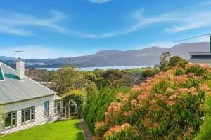 a white house with a view of the water at Stylish Rosetta Waterview Stay in Rosetta