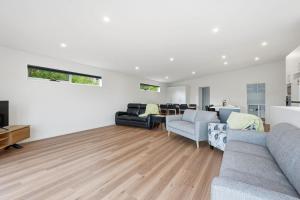 a living room with a couch and a table at Stylish Rosetta Waterview Stay in Rosetta