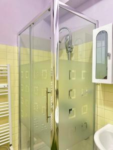 a glass shower in a bathroom with a sink at Venice Night B13 in Mestre