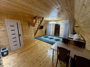 a small room with a staircase in a wooden house at A-Frame in Dolinka