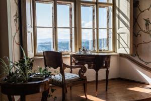 a chair and a desk in front of a window at Burg Bernstein in Bernstein