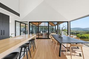 a kitchen and dining room with a table and chairs at Richmond Valley Luxe Escape in Richmond