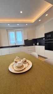 a table with a plate on top of it in a kitchen at Villa Miranda RELAX in Ortona