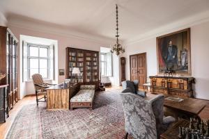 a living room with a couch and a table at Burg Bernstein in Bernstein