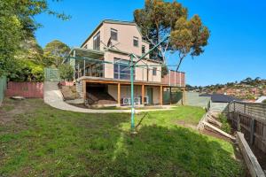 an image of a house with a yard at Riverview Townhouse Retreat in Lindisfarne