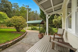 a porch with a bench and a gazebo at Riverbend Escape, Judbury in Judbury