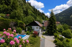 a house with a swimming pool in a mountain at Haus St Peter , midden in meren gebied van Karinthië in Radenthein