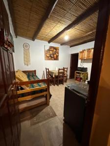 a kitchen and living room with a table and chairs at Luna Victoria - apart in Purmamarca
