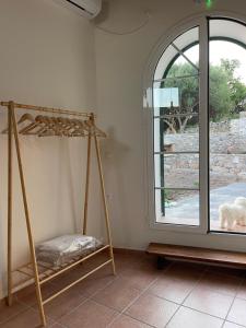 a room with two swings and a window at Matsipeti in Kythira