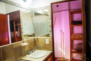 a bathroom with a sink and a mirror at Luna Victoria - apart in Purmamarca +50 photos