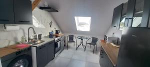a small kitchen with a sink and a dishwasher at Apartament u Buki Zator, Skawina, Kraków in Pozowice