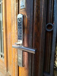 a metal door handle on a wooden door at Corazón de Palermo Soho in Buenos Aires