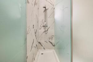 a bathroom with a shower with a toilet at Maison Azur Oeiras Beach in Oeiras +71 photos