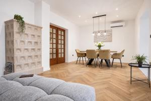 a living room with a couch and a table at Luma Luxury Apartment - 5 min Walk to the Beach in Sutomišćica