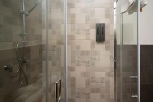 a bathroom with a shower with a glass door at CASALE DILETTOSO Etna Relais in Randazzo +77 photos