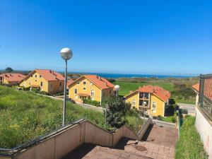 a group of houses on a hill with a street light at Casa Tia Nieves in Ruiloba
