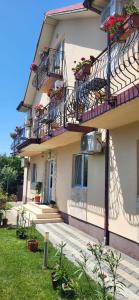 a building with balconies and flower boxes on it at Casa Sunshine in Vama Veche